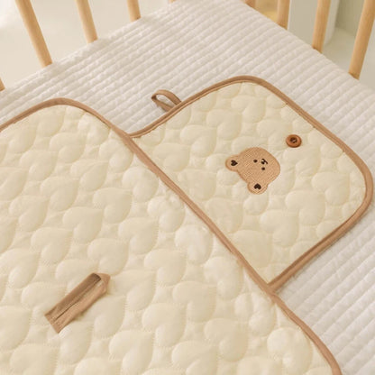Matelas à langer pliable